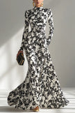 Black and white color-blocked printed long-sleeve maxi dress by FJØRNA with pleated skirt and front pockets in a slim-fit design.