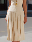 FJØRNA sleeveless V-neckline pleated midi dress with flowy fabric and elegant design, perfect for summer or formal occasions.