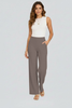 FJØRNA Bianca women's high-rise wide-leg trousers hanging on a rack, showcasing their flowy fabric and tailored fit.