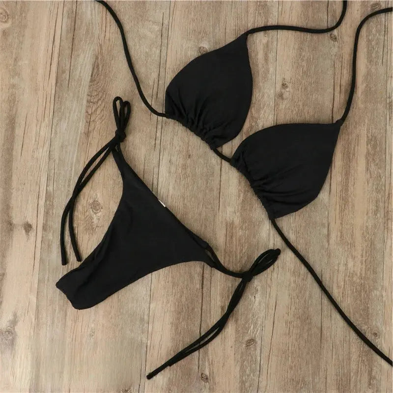 Women's golden shimmer bikini by FJØRNA, stylish swimwear for pool and beach, featuring a flattering fit and elegant design.