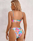 Women's tropical floral bikini by FJØRNA featuring a vibrant pattern, perfect for beach and summer swimwear.
