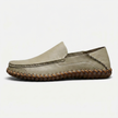 Men's handstitched PU leather slip-on loafers by FJØRNA with round toe, casual smart design, featuring a sleek brown finish.