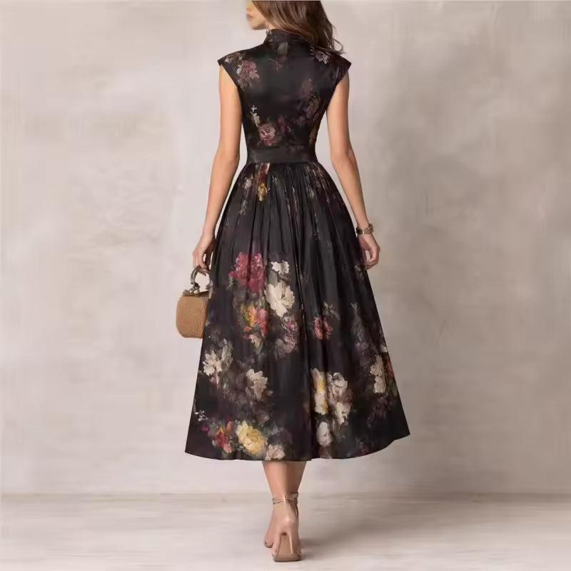 Back view of FJØRNA black floral midi dress with Mao neckline and keyhole detail, stylish and elegant for casual or formal wear.