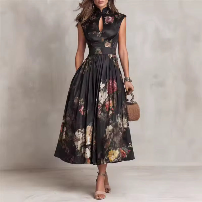 FJØRNA black floral midi dress with Mao collar and keyhole neckline, featuring long sleeves and a fitted silhouette.