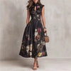 FJØRNA black floral midi dress with Mao collar and keyhole neckline, featuring long sleeves and a fitted silhouette.