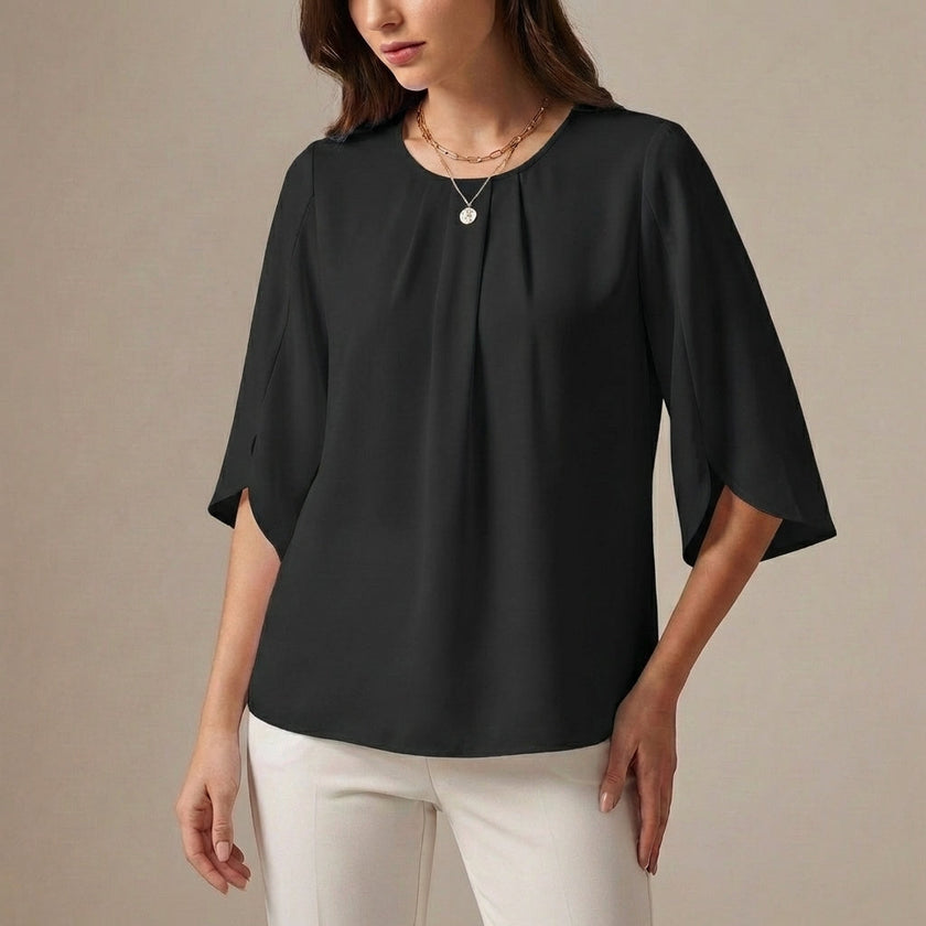 Black FJØRNA women's summer pleated blouse, casual top with a relaxed fit and stylish design, perfect for warm weather wear.