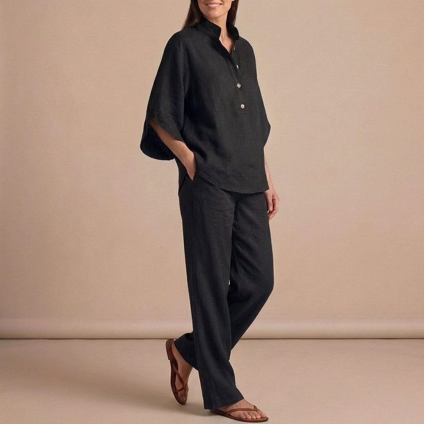 FJØRNA black woven two-piece relaxed shirt and wide-leg trouser set, casual urban leisure outfit on a model.
