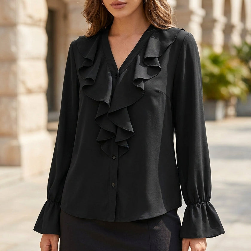 Black women's summer blouse by FJØRNA featuring a V-neck, long sleeves, and ruffle details.