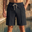 Men's black relaxed knee-length tailored shorts by FJØRNA with adjustable waist and stylish seam details.