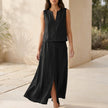 Black women's two-piece co-ord set with pockets and V-neck from FJØRNA, featuring a stylish, coordinated outfit with comfortable fit.