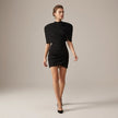 Black puff sleeve bodycon mini dress with high neck by FJØRNA, featuring fitted silhouette and stylish design.