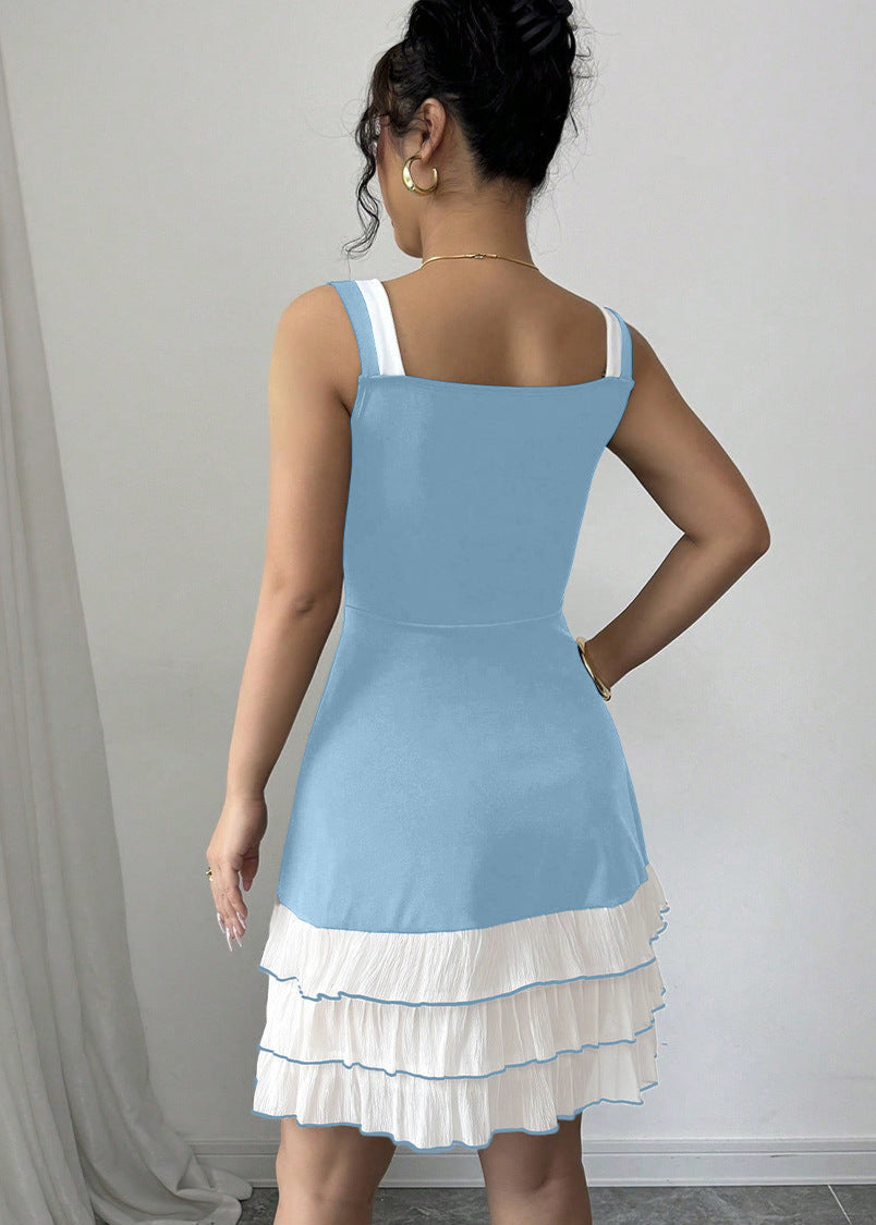 Blue FJØRNA summer party dress with bow detail, back view showcasing the stylish mini dress design.