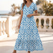Blue FJØRNA ruffled hem A-line maxi dress for women, flowing design with a stylish ruffled hem and elegant silhouette.