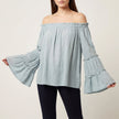 Blue FJØRNA summer women's blouse with off-shoulder design and bell sleeves, stylish top for warm weather.