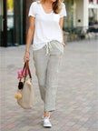 FJØRNA linen summer trousers for women with a breezy, relaxed fit and straight leg design, featuring a drawstring waistband.