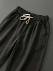 FJØRNA linen summer trousers for women with a breezy, relaxed fit and straight-leg design featuring a drawstring waist.