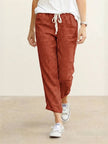 FJØRNA linen summer trousers for women with straight leg fit, drawstring waist, breathable and relaxed for warm weather.