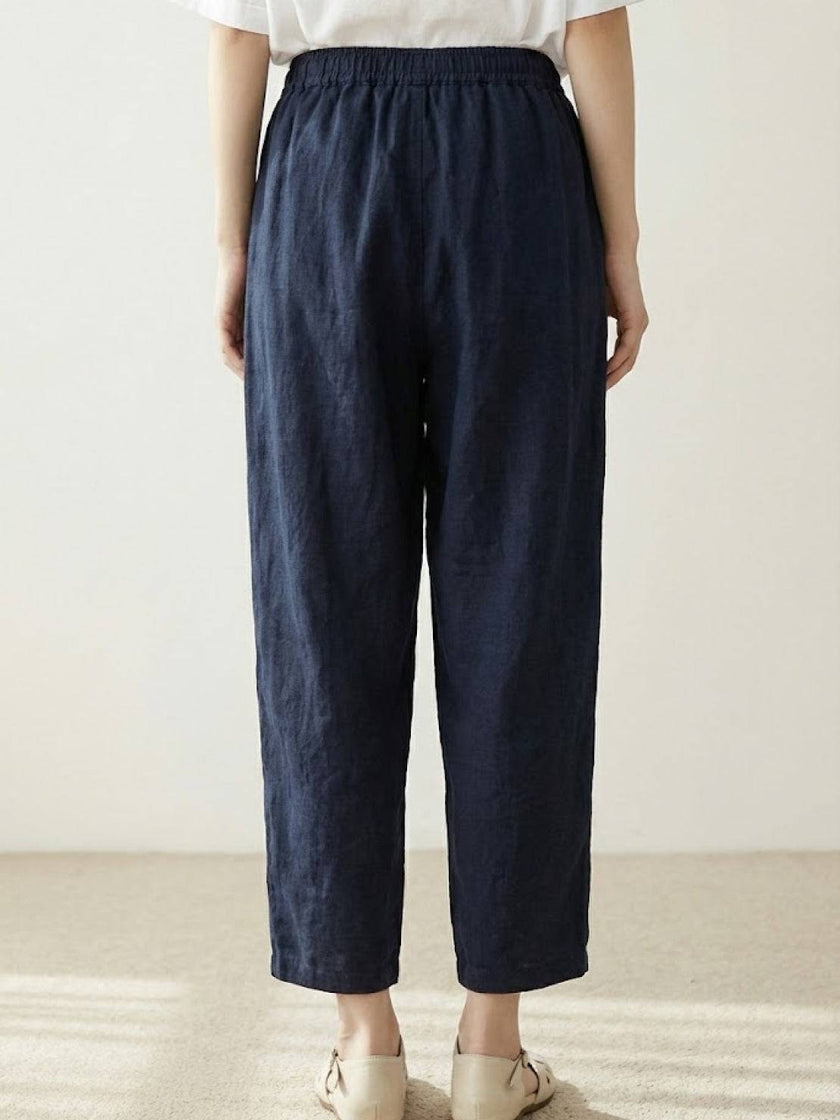 FJØRNA women's linen summer trousers with straight leg fit, drawstring waist, breathable lightweight fabric, relaxed style.