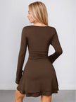 Back view of FJØRNA white ruched waist A-line dress, long-sleeve mini dress showcasing fitted waist and classic silhouette.
