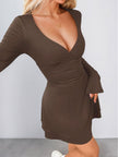 FJØRNA white ruched waist A-line dress shown from side angle, highlighting the fitted bodice and flared skirt.