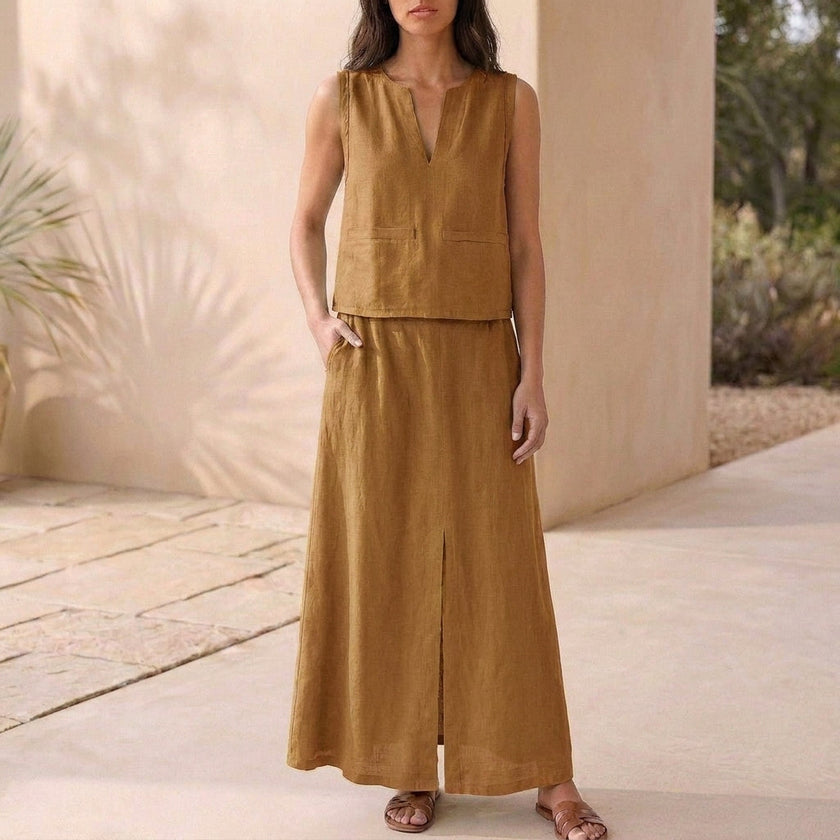 FJØRNA women's two-piece co-ord set in brown with V-neck top and matching pants, featuring side pockets and a stylish, elegant design.