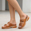 Brown FJØRNA orthopedic buckle platform slide sandals for women with wide straps and cushioned soles.
