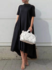 FJØRNA high-low white maxi dress with short sleeves and solid color, flowing and elegant for casual or formal wear.