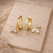 Unisex piercing set from FJØRNA featuring various jewelry accessories for women, displayed on a white background.