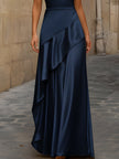 FJØRNA satin sleeveless maxi dress with asymmetric draping, elegant and flowing, showcased on a model.