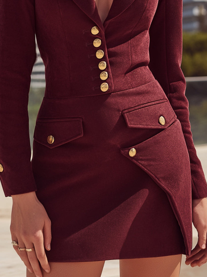 FJØRNA burgundy tailored blazer-style mini dress with gold-tone buttons, featuring a fitted silhouette and stylish lapel detailing.