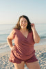 FJØRNA women's summer tankini set with ruffles and V-neck, featuring a colorful swim top and matching bottoms on a model.