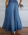 FJØRNA lightweight summer women's trousers with relaxed fit, elastic waist, and breathable fabric, shown on a model.