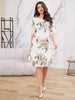 Elegant white gas dress by FJØRNA featuring flowing fabric and a sophisticated silhouette, perfect for formal occasions.