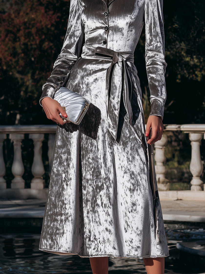 FJØRNA button-front belted midi coat dress for women, stylish long dress with a fitted waist and classic collar, shown on model.
