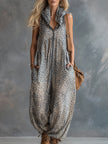 FJØRNA apricot leopard print hooded chiffon jumpsuit with long sleeves and a relaxed fit, featuring a stylish hood and leopard pattern.