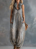FJØRNA apricot leopard print hooded chiffon jumpsuit with long sleeves and a relaxed fit, featuring a stylish hood and leopard pattern.