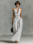 FJØRNA striped linen sleeveless women’s jumpsuit with single-breasted design and V-neck, featuring stylish pant pants.