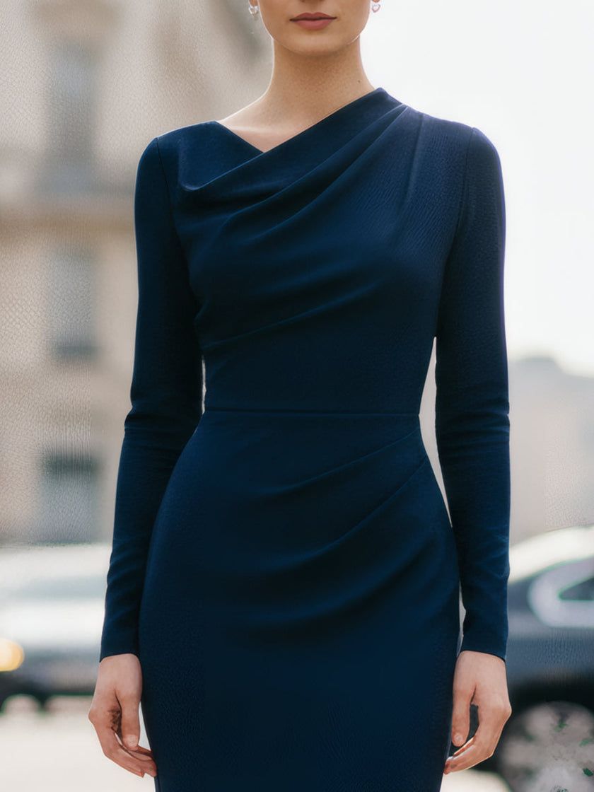 Navy FJØRNA draped midi dress with flowing fabric and elegant silhouette, displayed on a hanger against a neutral background.