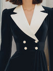 FJØRNA black velvet blazer dress with contrast lapel, double-breasted front, and tailored fit, shown on a model.