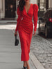 Elegant red satin midi dress with polka dots by FJØRNA, featuring a flowing silhouette and chic design.