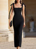 FJØRNA bow-shoulder square-neck evening dress for women, stylish sleeveless dress with elegant design and fitted silhouette.