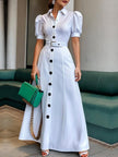 White FJØRNA maxi dress with puff short sleeves, belted waist, button details, and a lapel collar, perfect for elegant summer wear.
