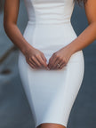 FJØRNA white zip-front bodycon dress showcasing a sleek, fitted design with a high neckline and long sleeves.