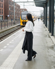 Lightweight high-waisted wide-leg wrap trousers for women by FJØRNA, featuring a relaxed fit and sleek summer style.