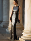 FJØRNA sculpted panel evening gown with sleeveless silhouette, featuring a sleek, elegant maxi dress design with subtle sleeve details.