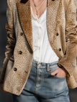 FJØRNA khaki leopard print colour-block velvet blazer hanging on a rack, showcasing its stylish design and bold pattern.