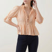 FJØRNA women's champagne summer blouse with V-neck, puff sleeves, and lace details, stylish and lightweight top for warm weather.