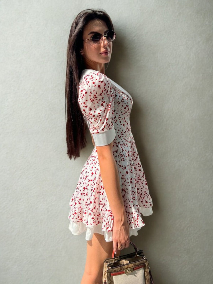 FJØRNA vintage summer A-line dress with cherry print and white collar, perfect as a casual wedding dress, shown from side view.