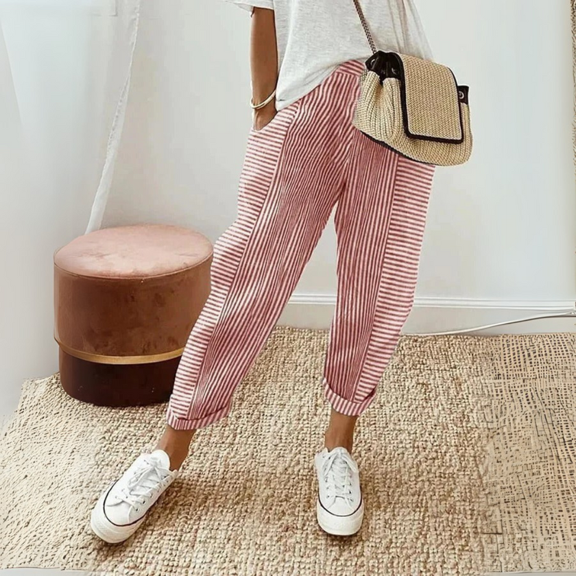 FJØRNA lightweight summer women's wide-leg trousers with breathable fabric and side pockets, featuring a striped pattern.