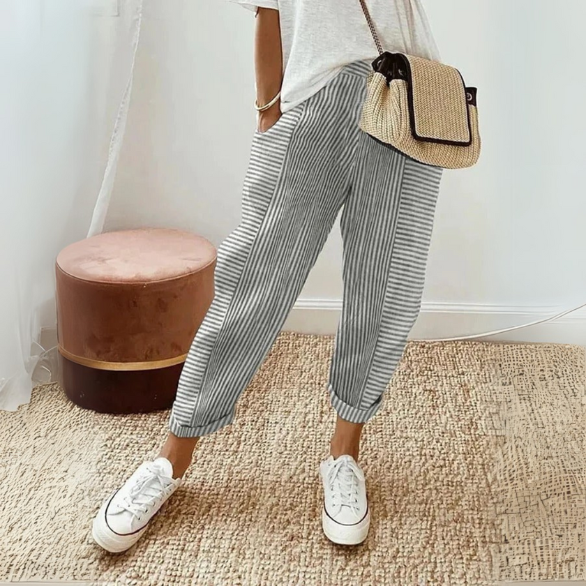 FJØRNA women's lightweight wide-leg summer trousers with striped pattern, breathable fabric, and side pockets.